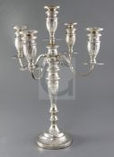 A George V silver four branch, five light candelabrum by Sigmund Zyto, with four scroll arms and