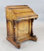 A Victorian burr walnut davenport, with jack-in-a-box stationery compartment, W.2ft 3.5in. D.1ft