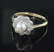 A mid 20th century 18ct gold and platinum, cultured pearl and diamond cluster ring, size N.