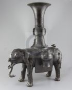 A massive Chinese bronze elephant-form censer, Ming dynasty, with standing caparisoned elephant