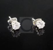 A pair of 18ct white gold and diamond ear studs, each stone weighing approximately 0.35cts.From