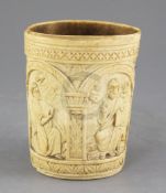 A carved ivory situla, late 19th century in Medieval style, carved in relief with the figures of