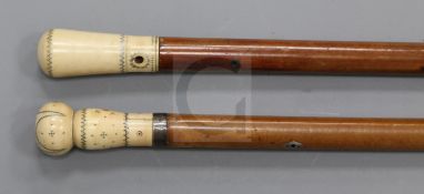 Two 19th century malacca canes, with silver piqué work ivory knop handles, 39.5in. and 37.5in.