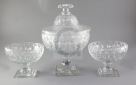 A Baccarat covered glass pedestal punch bowl, on square foot and a pair of matching side bowls,