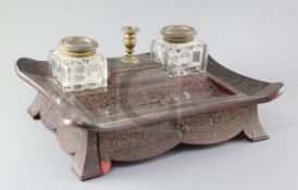 A William IV ormolu and red boullework ink stand, with two cut glass wells, taperstick and base