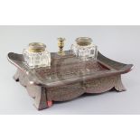 A William IV ormolu and red boullework ink stand, with two cut glass wells, taperstick and base