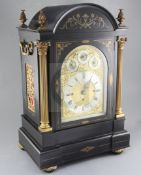 A late 19th century ebonised and brass inlaid quarter chiming bracket clock, the breakarch case with