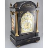 A late 19th century ebonised and brass inlaid quarter chiming bracket clock, the breakarch case with