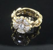 A Gianni Versace 18ct gold and diamond set flowerhead ring, the shank of curb link design and signed