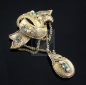 A Victorian Celtic Revival gold, emerald and pearl set drop pendant locket brooch, 67mm.