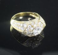 An 18ct gold claw set single stone diamond ring, of hexagonal form, the setting and shoulders set