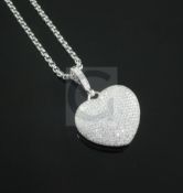 A Theo Fennell 'Art 18ct white gold and diamond encrusted heart shaped pendant, with diamond set