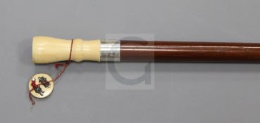 A late Victorian hardwood walking stick, with silver banded Japanese ivory panel opening to reveal a