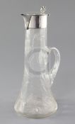 An Edwardian silver mounted cut glass claret jug by Robert Pringle & Sons, on panelled tapering form