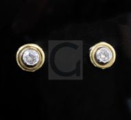 A pair of Theo Fennell 18ct gold and diamond earstuds, each stone weighing approximately 0.35cts.