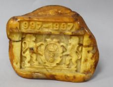 A piece of raw amber carved with the crest of the Polish City of Gdansk with the date "997-1997"