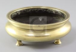 A Chinese bronze censer, ding, Xuande mark, 18th / 19th century, of compressed globular form on