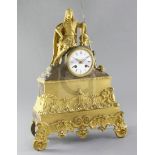 A French Régence gilt and patinated ormolu mantel clock, surmounted by the figure of a seated