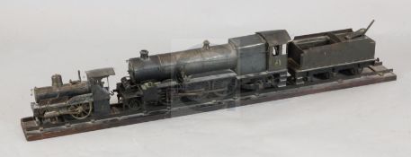 A scratchbuilt model of a 262 steam powered locomotive and tender, length 37in., and a similar model