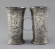 A pair of 17th century style pewter flared vases, with floral wrigglework decoration, crowned rose