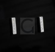 A pair of Theo Fennell "Strip" 18ct white gold and channel set diamond ear studs, each set with