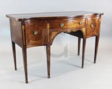 A George III satinwood banded mahogany serpentine sideboard, later inlaid with paterae and