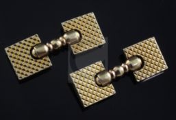 A pair of Cartier 14ct gold cufflinks, of hinged square form, with engraved decoration and turned