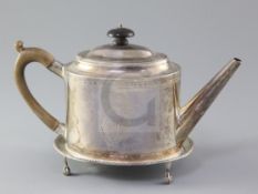 A George III silver teapot and stand, by Hester Bateman, of oval form with beaded borders and