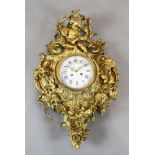 A third quarter of the 19th century French ormolu cartel clock surmounted by a Bacchanalian