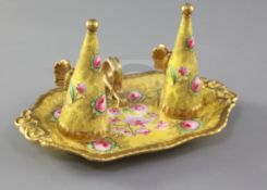 A pair of Copeland & Garrett candle extinguishers and stand, c.1830-40, painted with pink flowers