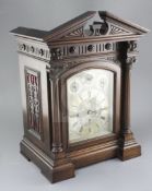 A late 19th century quarter chiming bracket clock, the architectural case with 7 inch silvered Roman