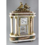 A 1930's polychrome onyx portico mantel clock, surmounted by ormolu doves, the 3.5 inch Arabic