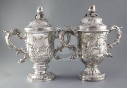 Two handsome George II silver horse racing related presentation trophy cups and covers, both