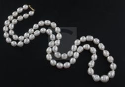 A modern single strand baroque pearl necklace with 18ct gold clasp, 83cm.From the estate of the late