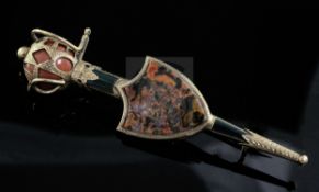 A Victorian Scottish gold and hardstone set sword and shield brooch, with engraved decoration, the