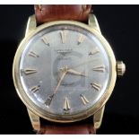 A gentleman's 1950's/1960's 18ct gold Longines Conquest automatic wrist watch, with arrowhead