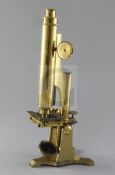 A late 19th century lacquered brass Smith and Beck monocular microscope, in original fitted case