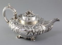 A good William IV Irish silver teapot by Richard Sawyer, of squat inverted pear form and embossed