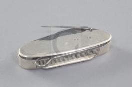 A late Victorian silver combination vesta case and penknife, by Louis Dee, of plain oval form,