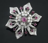 A platinum, ruby and diamond flowerhead brooch, 40mm.