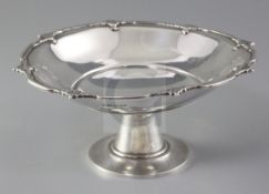 A 1930's silver comport by Asprey & Co Ltd, with decorated rim and central engraved monogram,