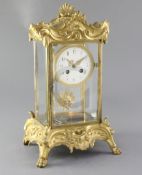 A late 19th century French ormolu mounted four glass clock, Planchon, Paris, with rocaille work