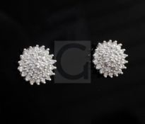 A pair of 18ct white gold and diamond cluster ear studs, of stepped circular form, diameter 11.5mm.