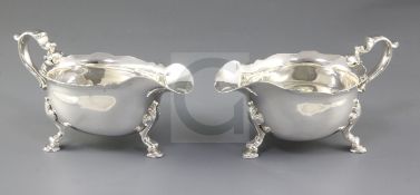 A pair of George II silver sauce boats, attributed to Joseph Sanders, hallmarked London 1734, with