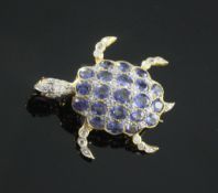 An 18ct gold, sapphire, diamond and cabochon ruby set turtle pendant brooch, with articulating head,