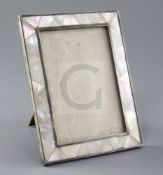 A 1920's silver and mother of pearl mounted photograph frame by Padgett & Braham, of rectangular