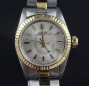 A lady's 1980's gold and steel Rolex Oyster Perpetual wrist watch, with baton numerals, model no.