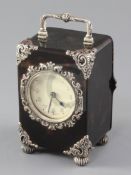 A George V silver mounted tortoiseshell carriage clock, with Arabic dial and repousse silver mounts,