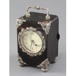 A George V silver mounted tortoiseshell carriage clock, with Arabic dial and repousse silver mounts,