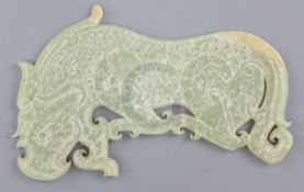 A Chinese archaistic yellow jade plaque, Eastern Zhou dynasty or later, in the form a mythical beast